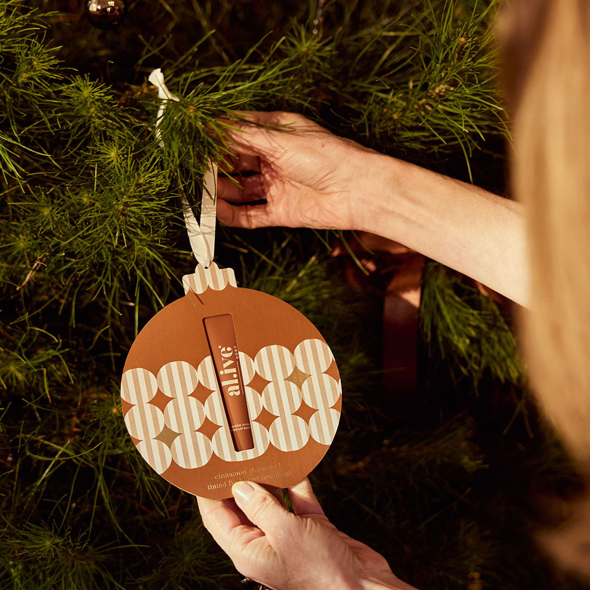 al.ive Body Tinted Lip Butter Ornament - Cinnamon and Citrus