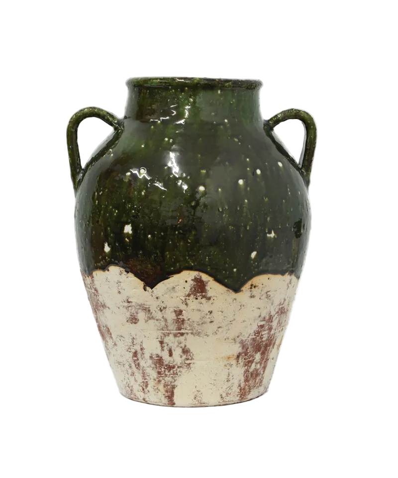 Ceramic vase with green and white distressed finish on a white background