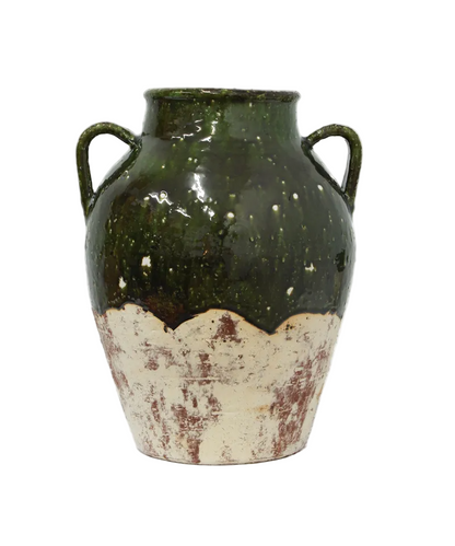 Ceramic vase with green and white distressed finish on a white background