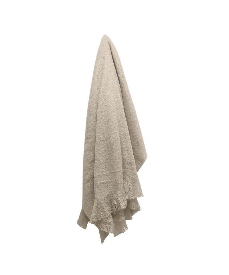 Beige blanket with fringe on a white background