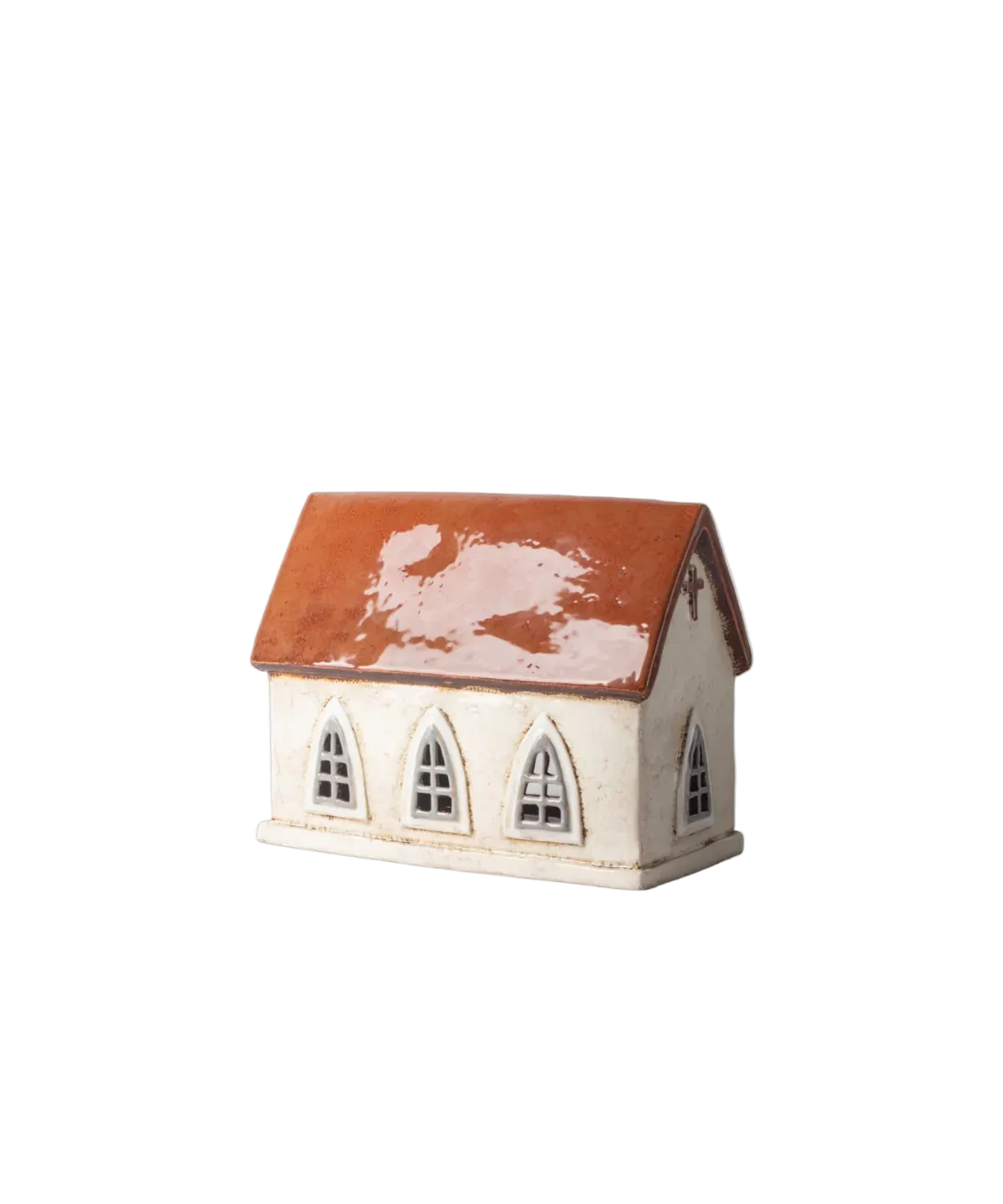 Small ceramic house with a red roof on a white background