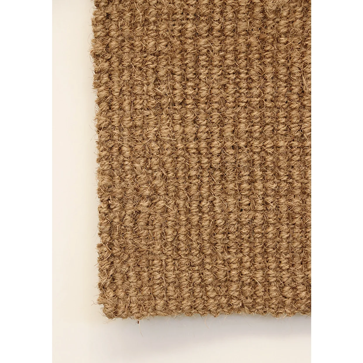 Textured brown rug on a white background