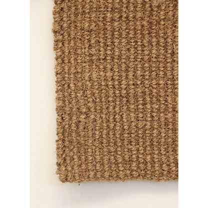 Textured brown rug on a white background